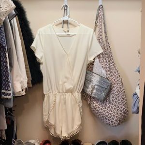 White romper with pompoms